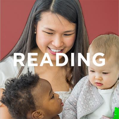 photo of mother reading with babies