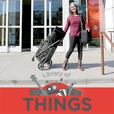 Photo of woman borrowing projector wth Library of Things logo