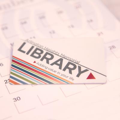 library card laying on a calendar