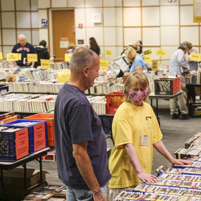 A Friends of the Library Member Helping a Customer